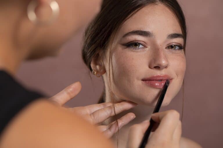 woman-getting-her-make-up-done-by-professional